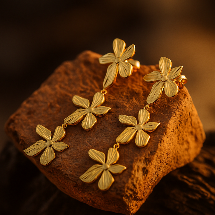 Aurora | Pétalos en el viento chapados en oro