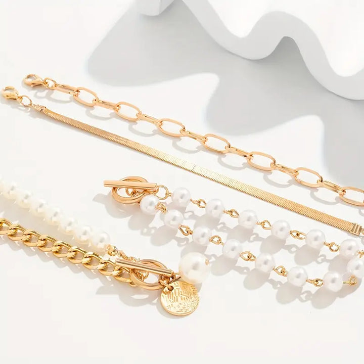 Conjunto elegante de pulseras - serpiente, perlas y eslabones | Oro