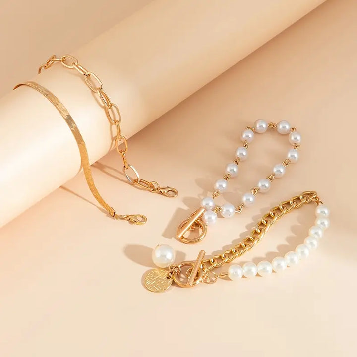 Conjunto elegante de pulseras - serpiente, perlas y eslabones | Oro