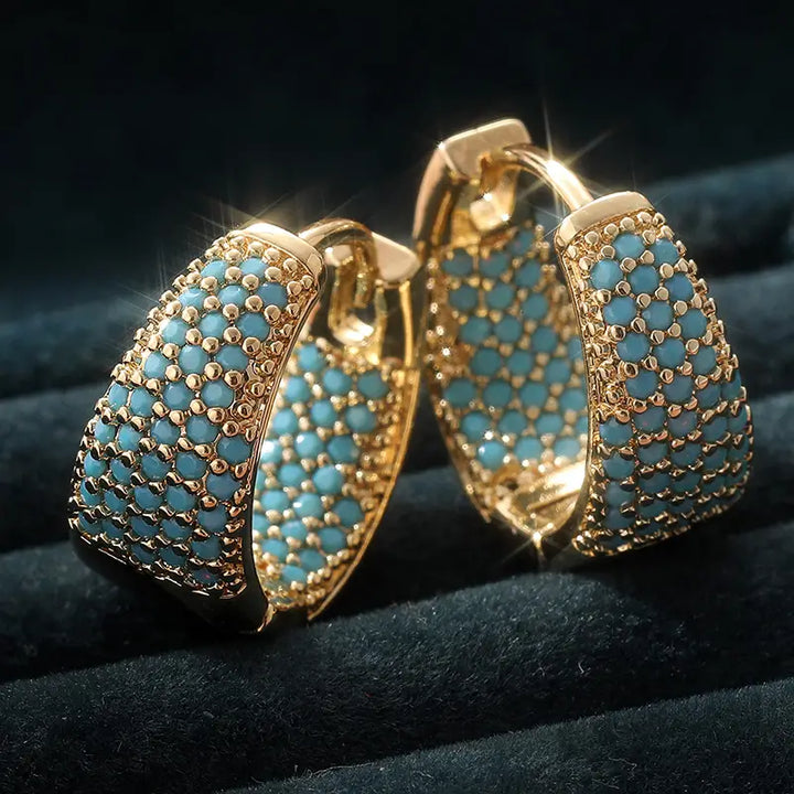 Pendientes de cuentas en tono dorado con turquesa | Oro